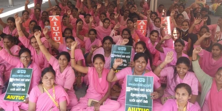 FILE- Asha-workers protest